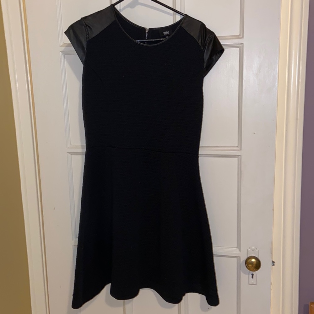 Black dress with faux leather details.